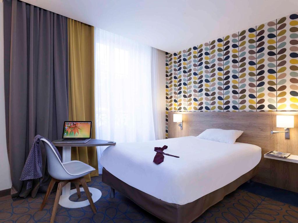 Postel nebo postele na pokoji v ubytování ibis Styles Chaumont Centre Gare
