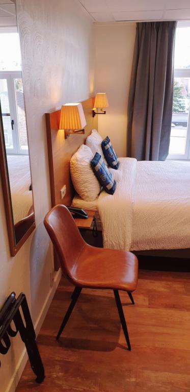 Postel nebo postele na pokoji v ubytování Hotel Asiris