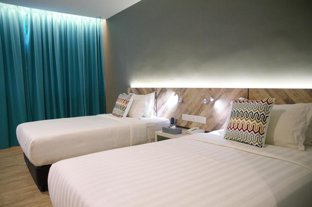 Postel nebo postele na pokoji v ubytování G5 HOTEL AND SERVICED APARTMENT