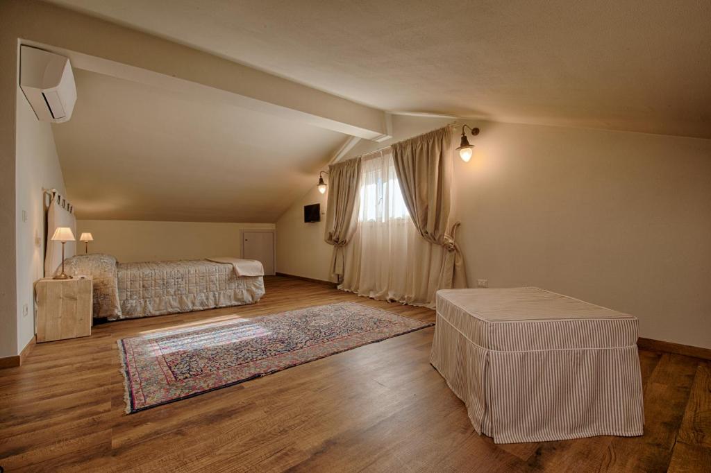 Postel nebo postele na pokoji v ubytování Agriturismo Poderedodici