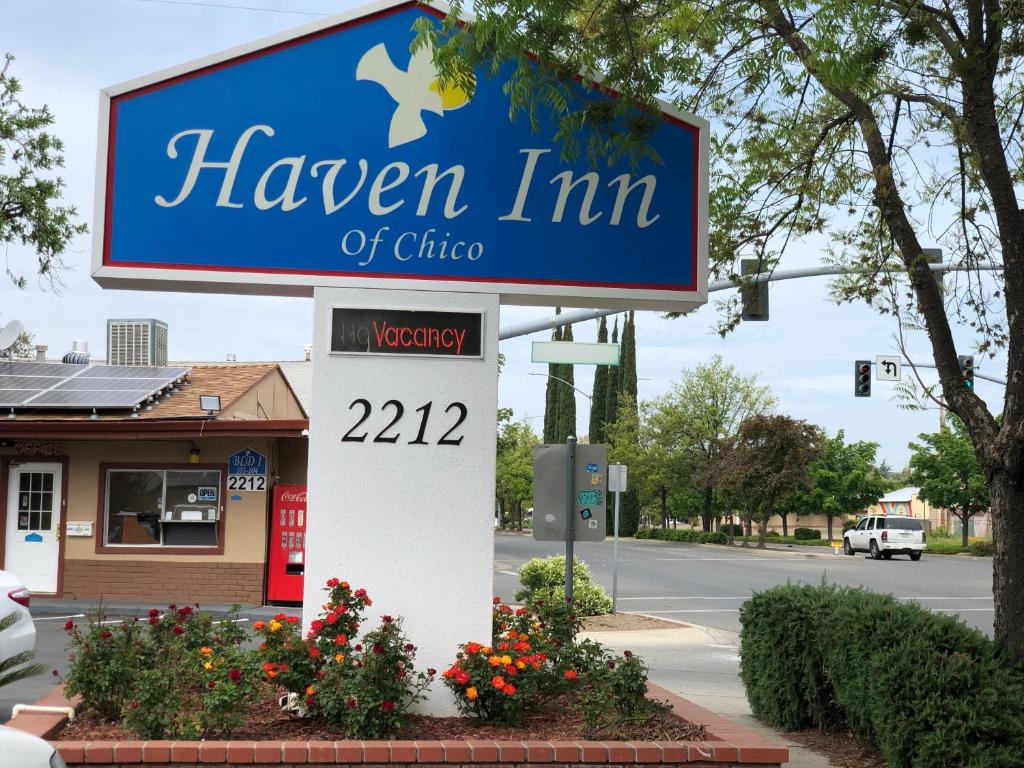 a sign for a tavern inn of china on a street at Haven Inn of Chico in Chico