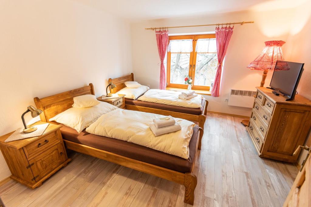 Postel nebo postele na pokoji v ubytování Penzion Hluk
