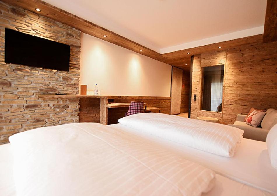 Postel nebo postele na pokoji v ubytování Spessart-Lodge
