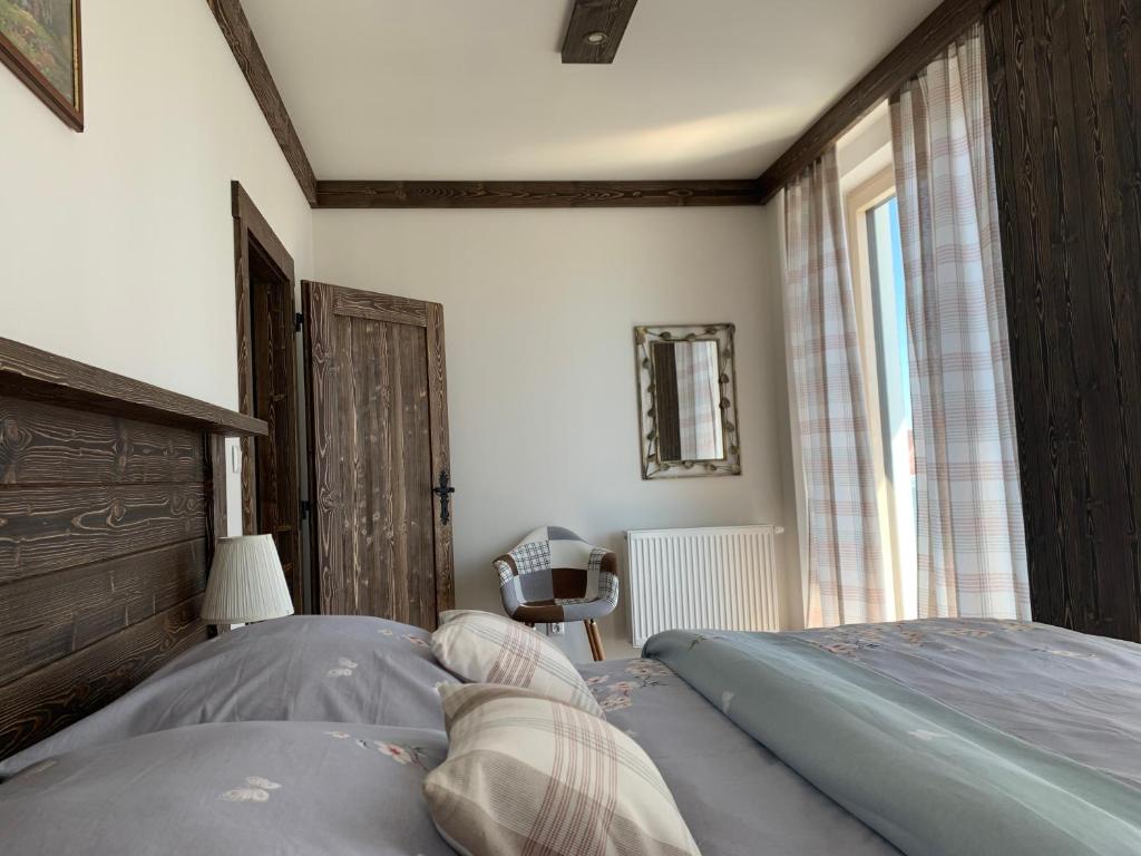Postel nebo postele na pokoji v ubytování Apartmány Veternica v Bernarde
