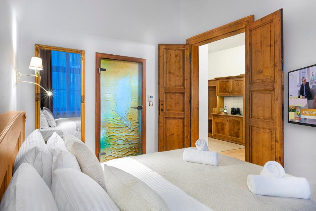 Postel nebo postele na pokoji v ubytování Ventus Rosa Boutique Aparthotel