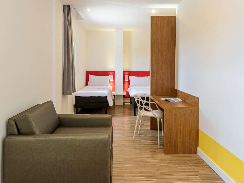 Postel nebo postele na pokoji v ubytování ibis Styles Birigui