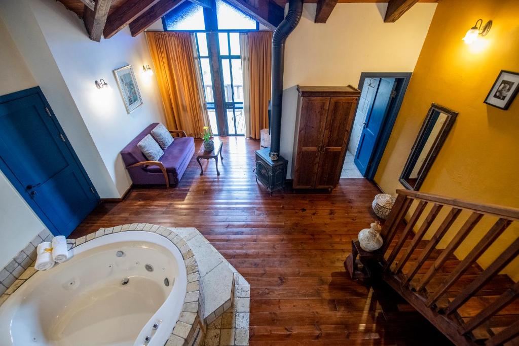 a large bathroom with a tub in the middle of a room at Suzanna in Odem in Odem