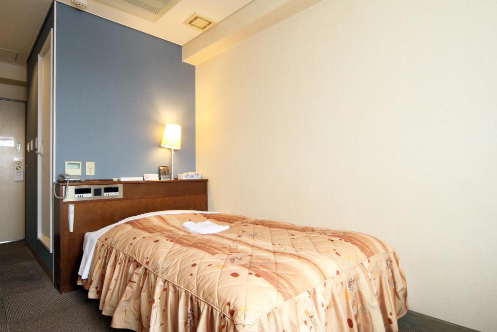Postel nebo postele na pokoji v ubytování Hotel Pao