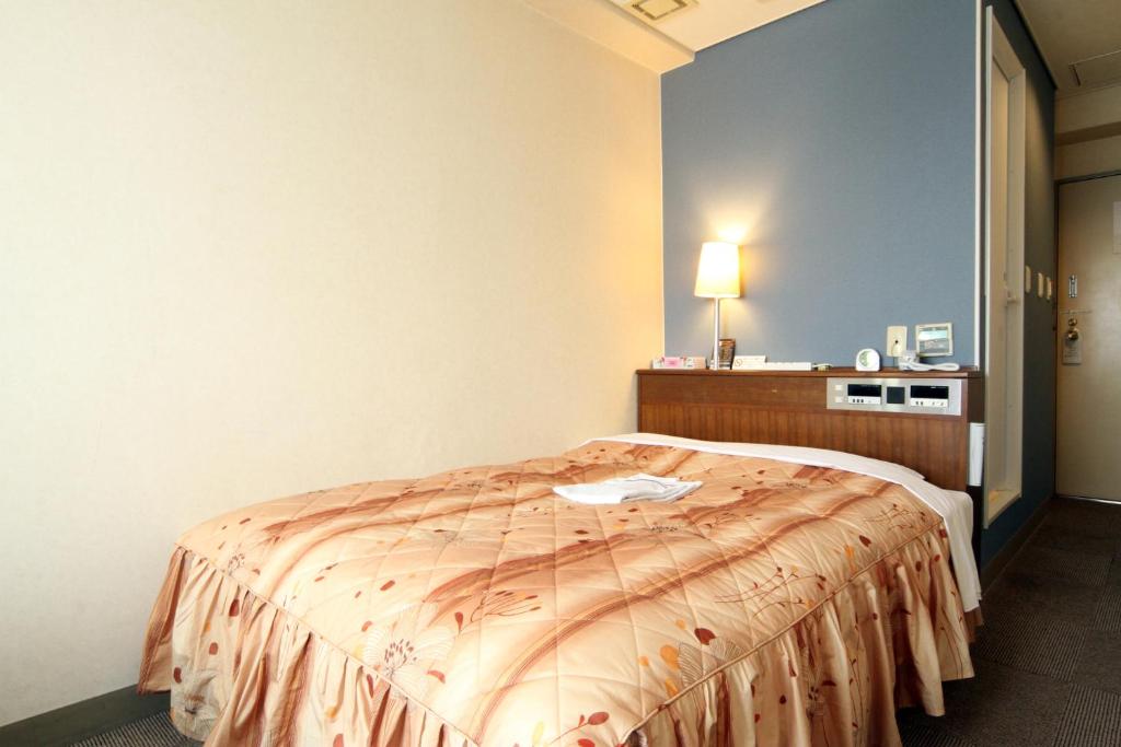 Postel nebo postele na pokoji v ubytování Hotel Pao