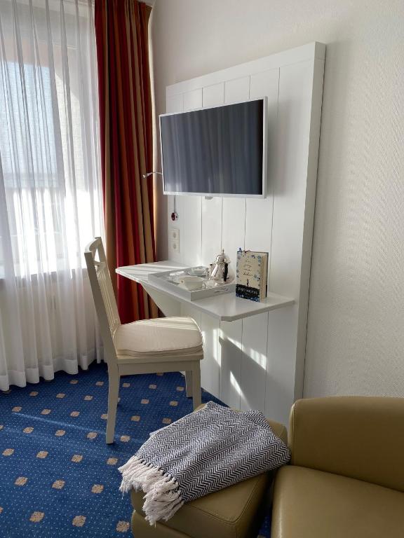 TV a/nebo společenská místnost v ubytování Hotel Wünschmann