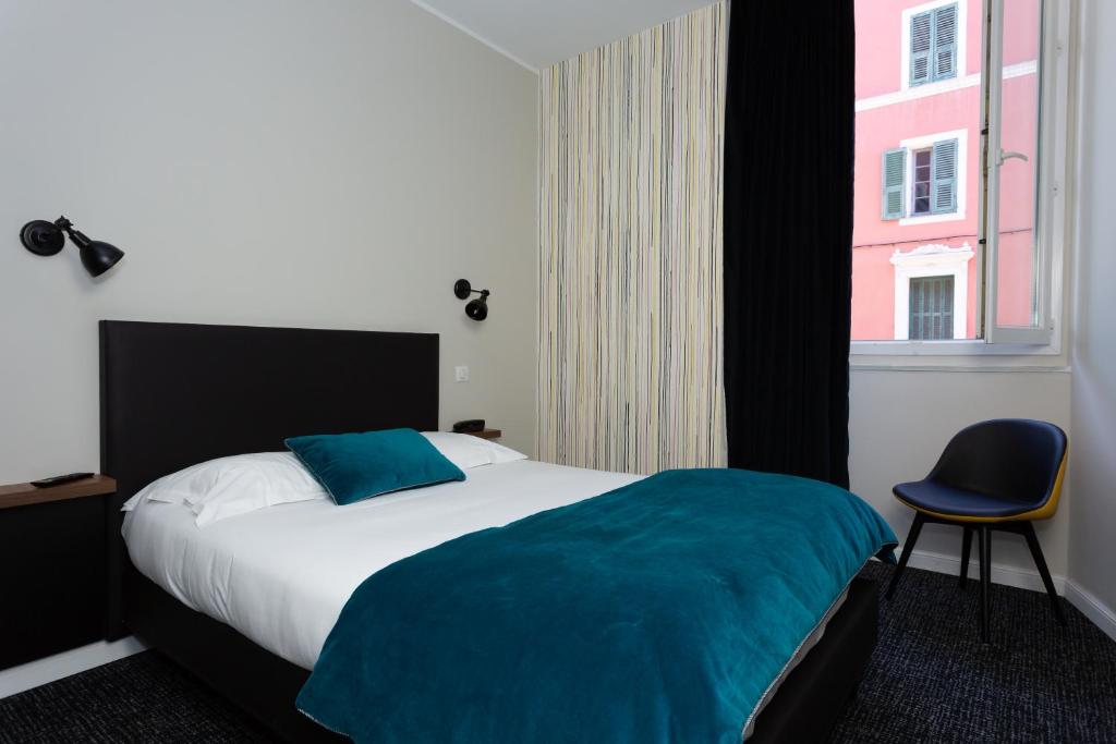 Postel nebo postele na pokoji v ubytování Babbu Hotel