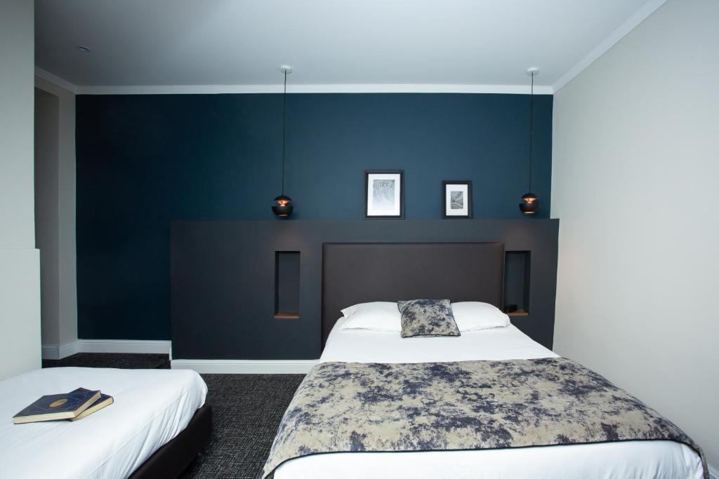 Postel nebo postele na pokoji v ubytování Babbu Hotel