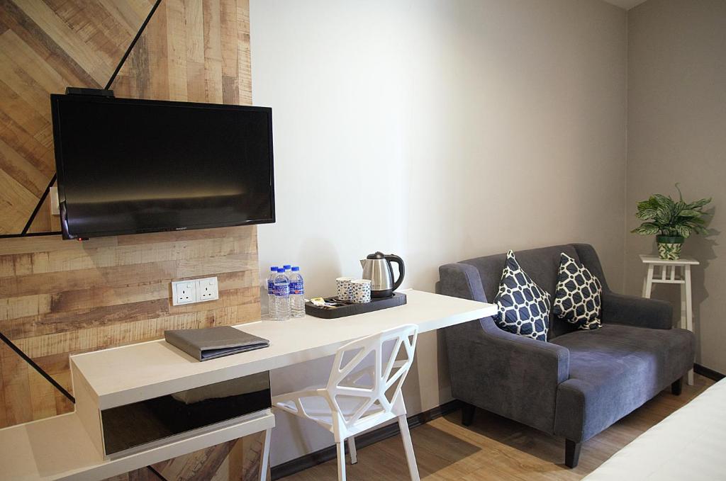 TV a/nebo společenská místnost v ubytování G5 HOTEL AND SERVICED APARTMENT