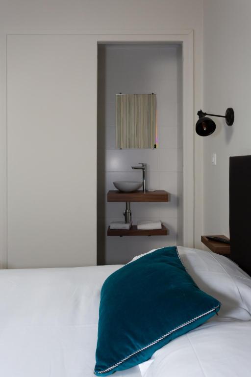 Postel nebo postele na pokoji v ubytování Babbu Hotel