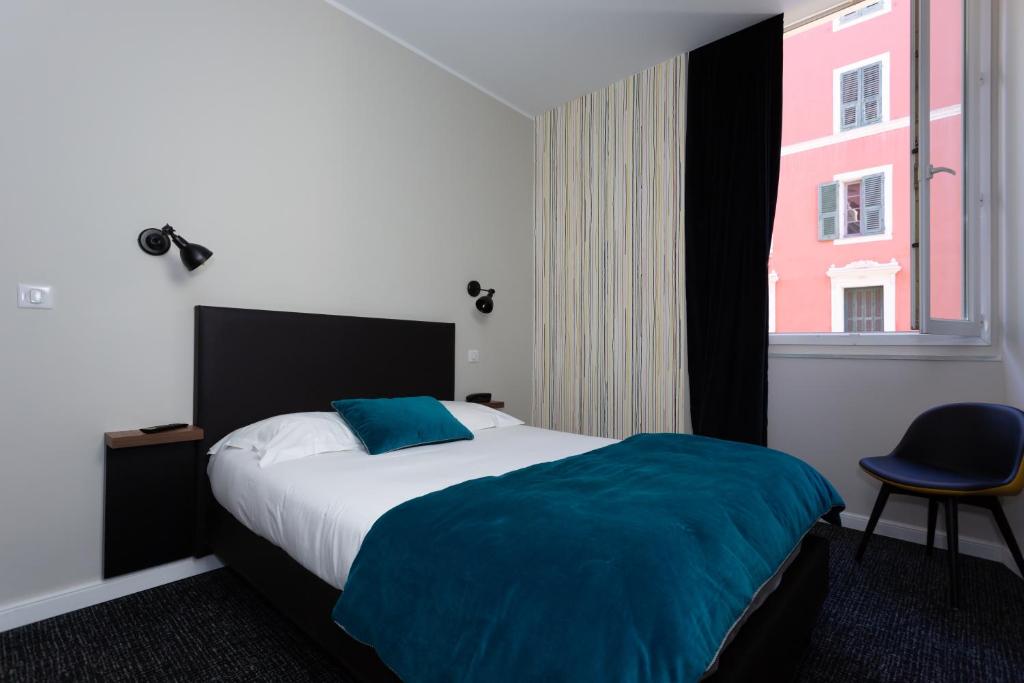 Postel nebo postele na pokoji v ubytování Babbu Hotel