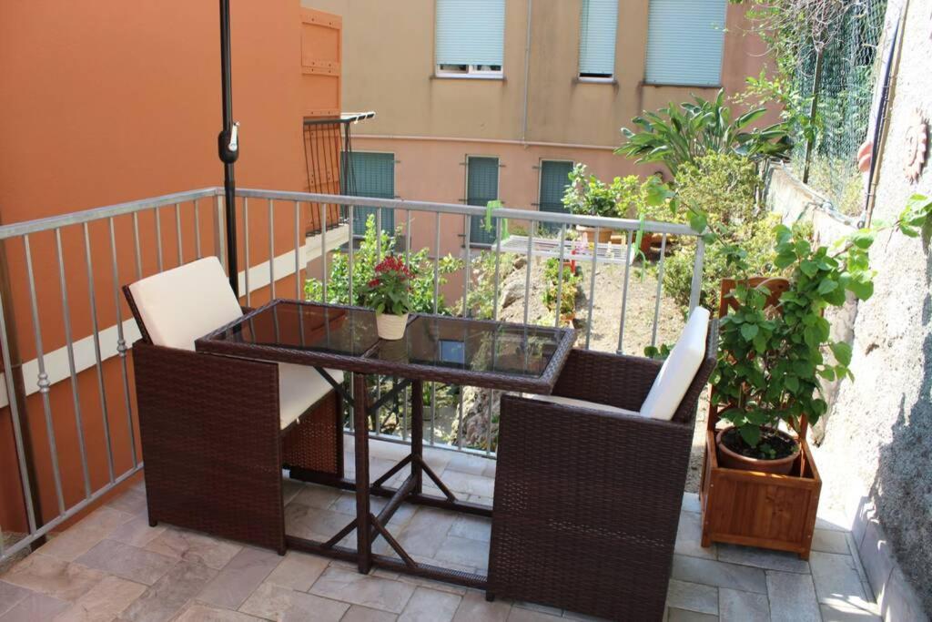 a table and chairs on a balcony with plants at Ca Du Rocco - CITRA 011019-LT-0343 in Monterosso al Mare