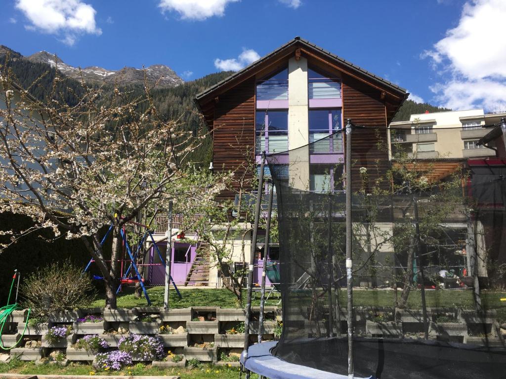 a house with a garden in front of it at B&B Gottardo in Airolo