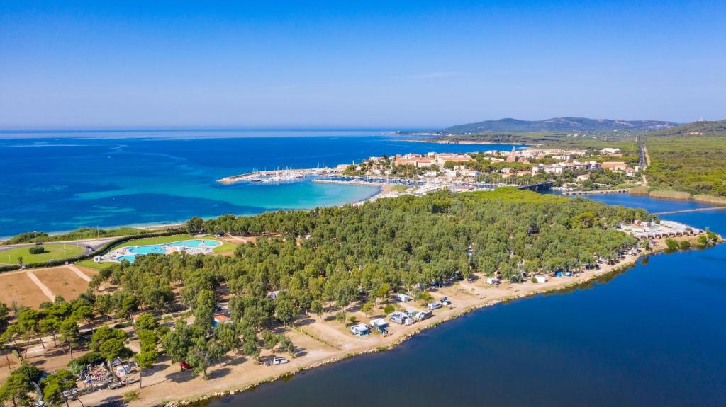 an aerial view of a resort on a island in the water at Camping Village Laguna Blu in Fertilia