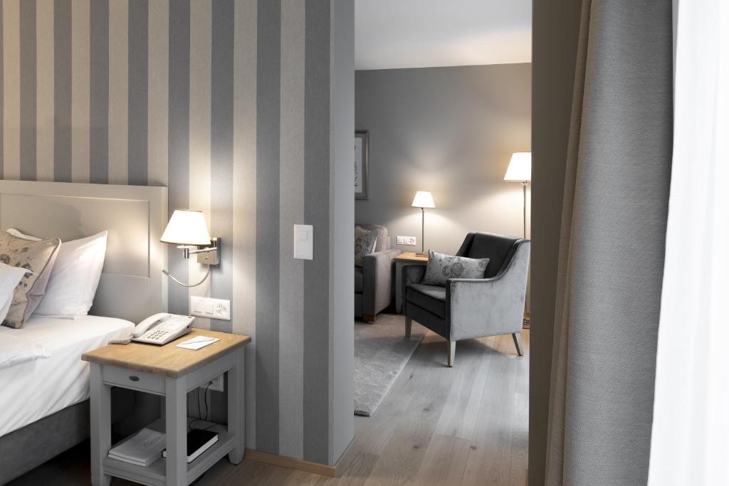 Postel nebo postele na pokoji v ubytování Hotel Ascovilla Charming Hideway