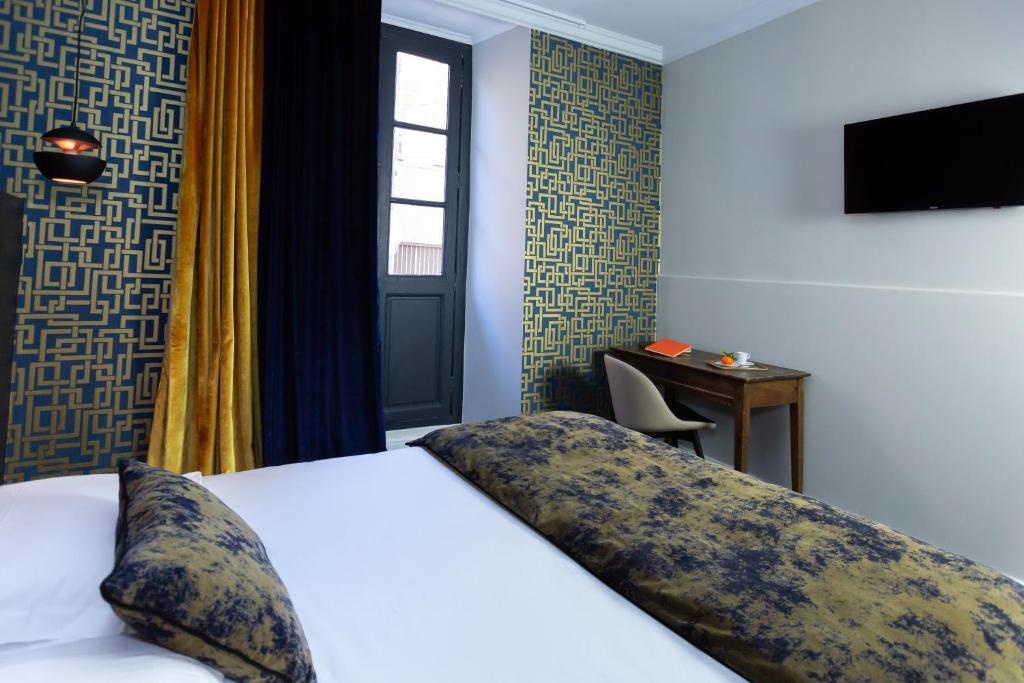 Postel nebo postele na pokoji v ubytování Babbu Hotel
