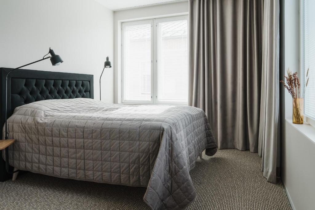 Кровать или кровати в номере Luxury Apartment Hovi