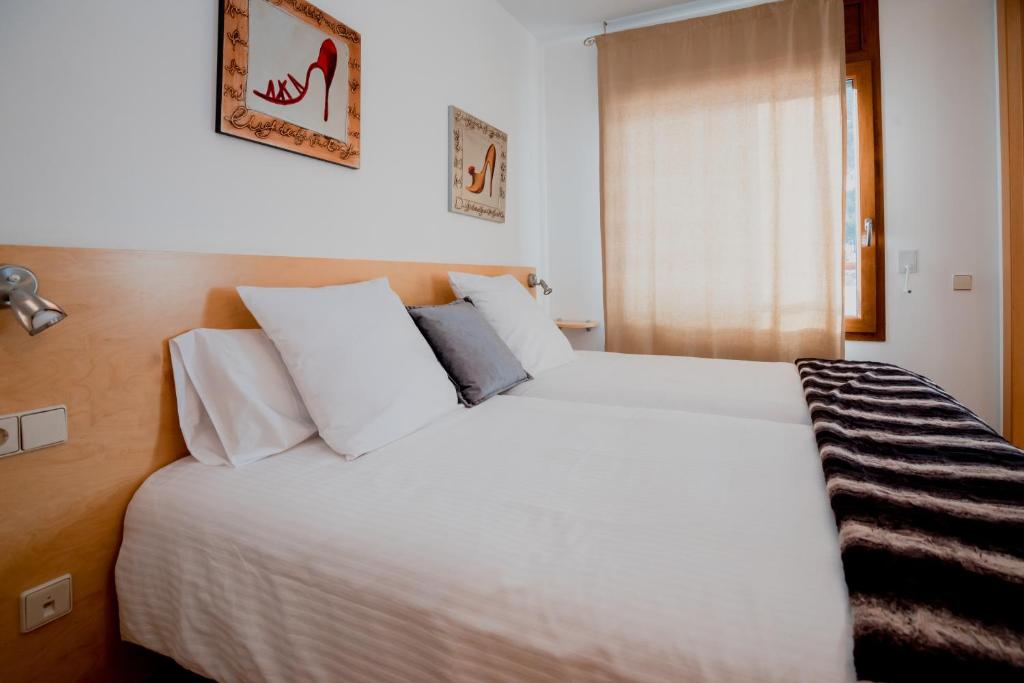Postel nebo postele na pokoji v ubytování Apartaments Ashome