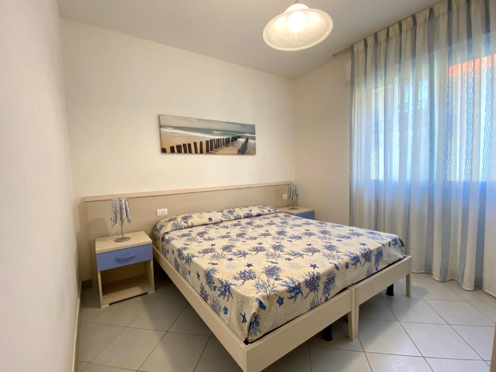 Postel nebo postele na pokoji v ubytování Artesi - Carraro Immobiliare Jesolo - Family Apartments