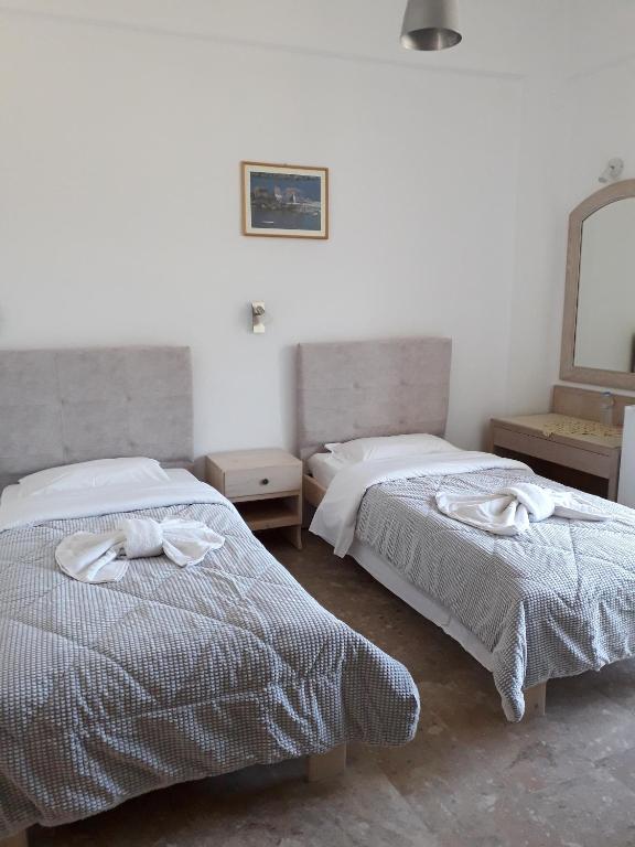 Postel nebo postele na pokoji v ubytování Knossos Hotel