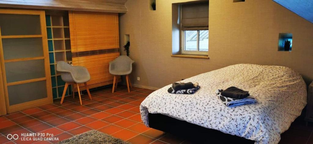 Postel nebo postele na pokoji v ubytování Le Durbuy Lodge