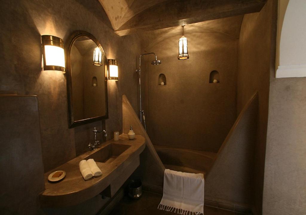 a bathroom with a sink and a mirror at Dar Beija in Marrakesh