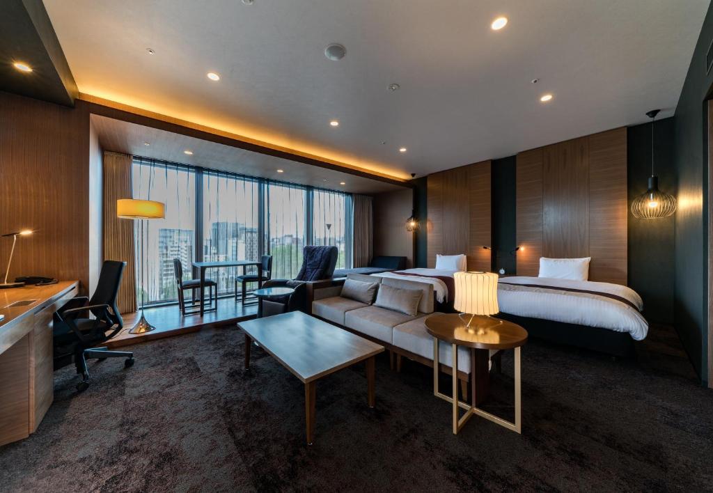 Daiwa Roynet Hotel Hakata Reisen PREMIER - former Daiwa Roynet Hotel Hakata Reisen客房内的一张或多张床位