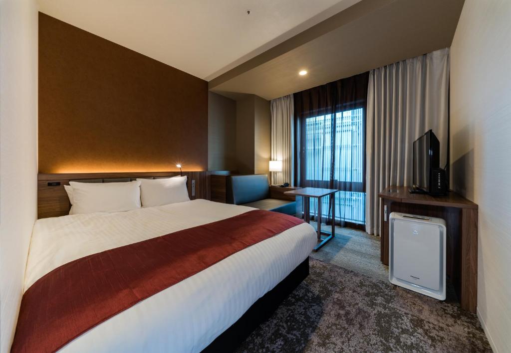 Daiwa Roynet Hotel Hakata Reisen PREMIER - former Daiwa Roynet Hotel Hakata Reisen客房内的一张或多张床位
