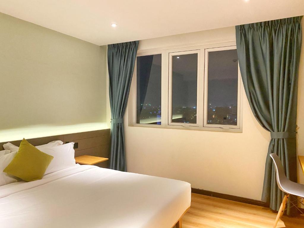 Postel nebo postele na pokoji v ubytování Yunfan Hotel