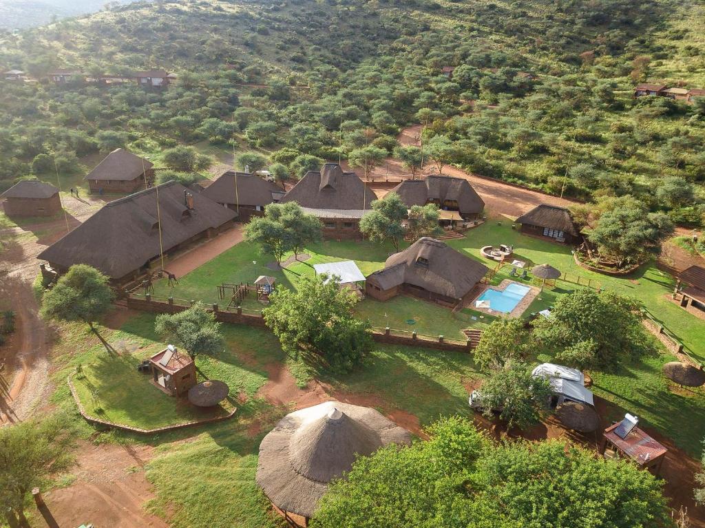 an aerial view of a village with tents at Red Sands Country Lodge in Kuruman