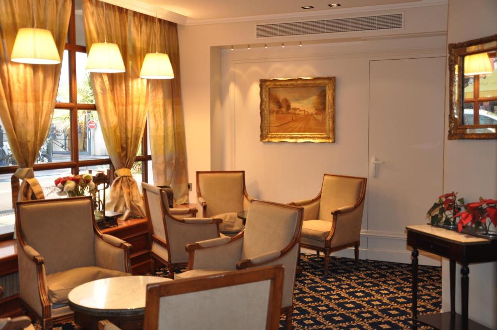 a waiting room with chairs and a table at Hotel Splendid in Cannes