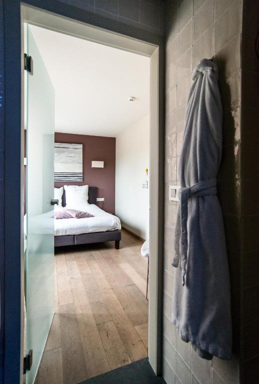 Postel nebo postele na pokoji v ubytování Hotel de la Paix