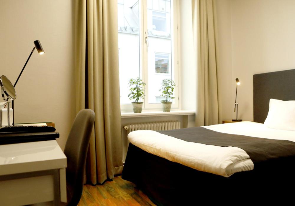 Postel nebo postele na pokoji v ubytování Grand Hotel Falkenberg