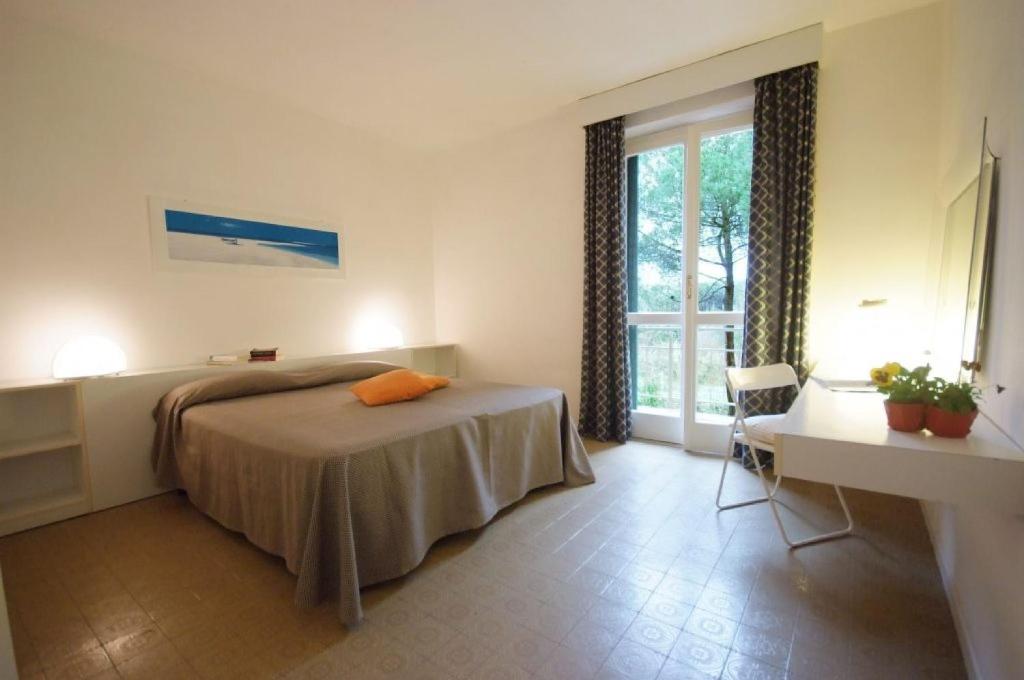 Кровать или кровати в номере Residence Golfo Della Lacona