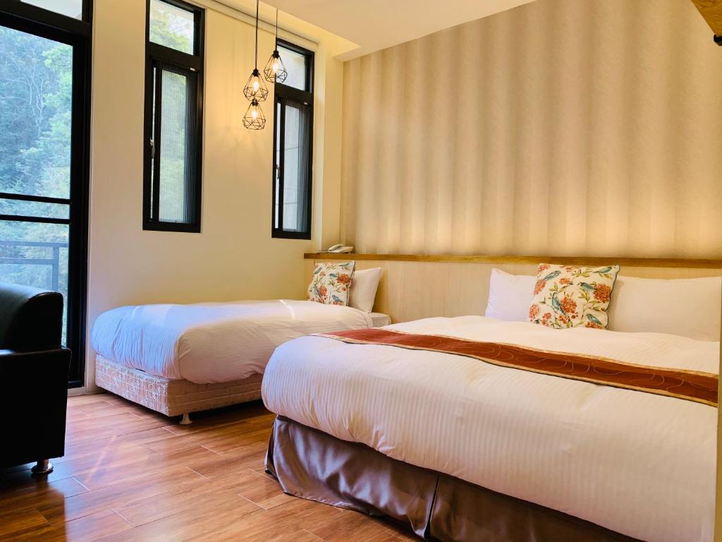 Postel nebo postele na pokoji v ubytování 日月潭沅居民宿 YUAN JU BOUTIQUE Hotel