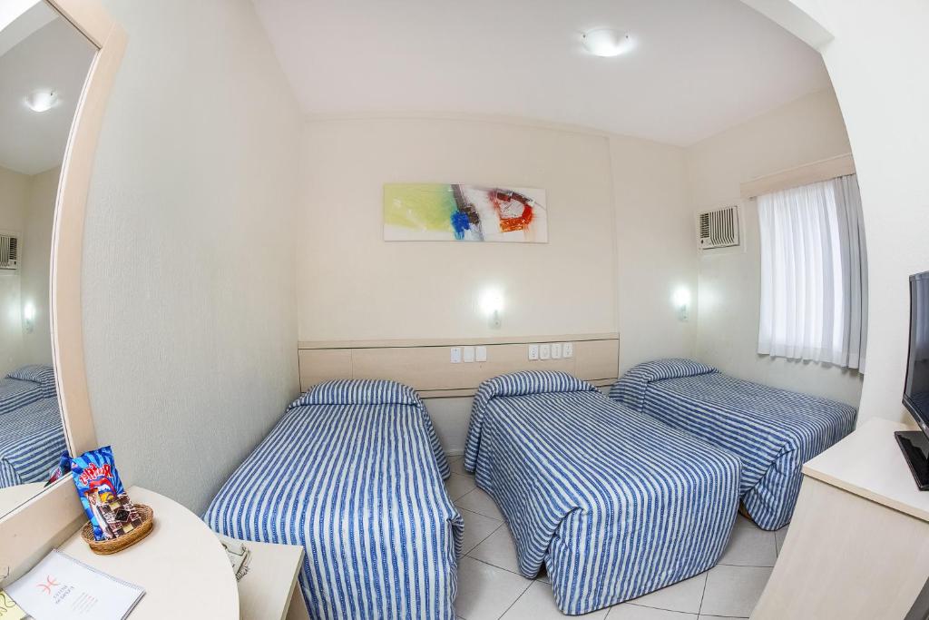 Postel nebo postele na pokoji v ubytování Hotel Express Canoas