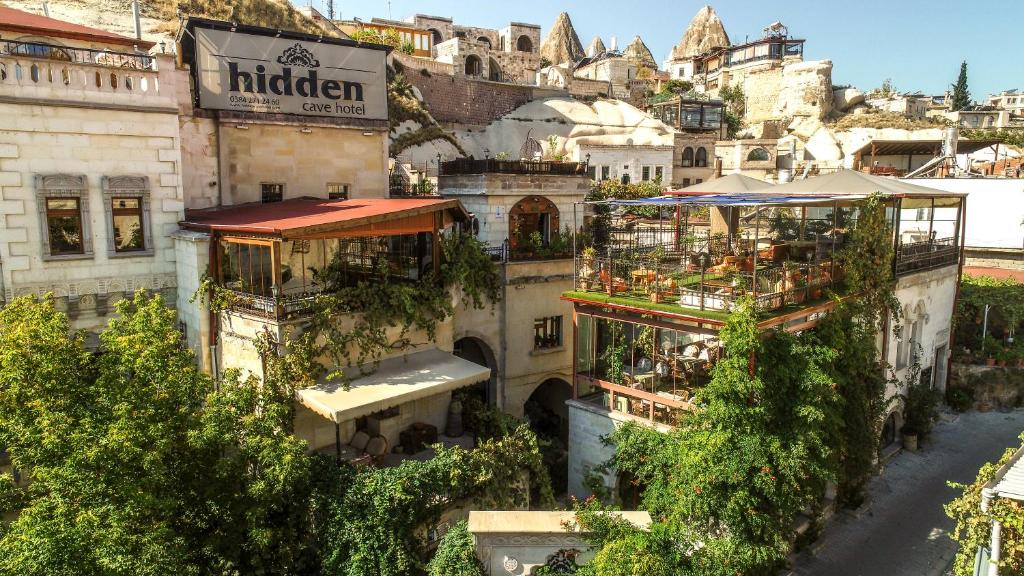 an overhead view of a city with buildings and trees at Hidden Cave Hotel in Göreme