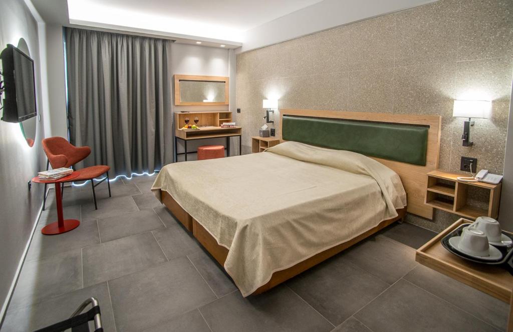 Postel nebo postele na pokoji v ubytování Palmyra Beach Hotel