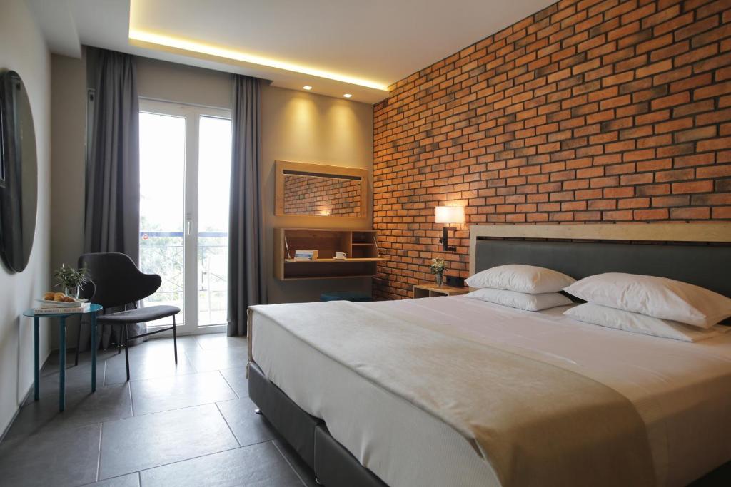Postel nebo postele na pokoji v ubytování Palmyra Beach Hotel