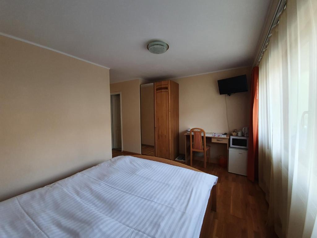 Postel nebo postele na pokoji v ubytování Le Merle Châtelain