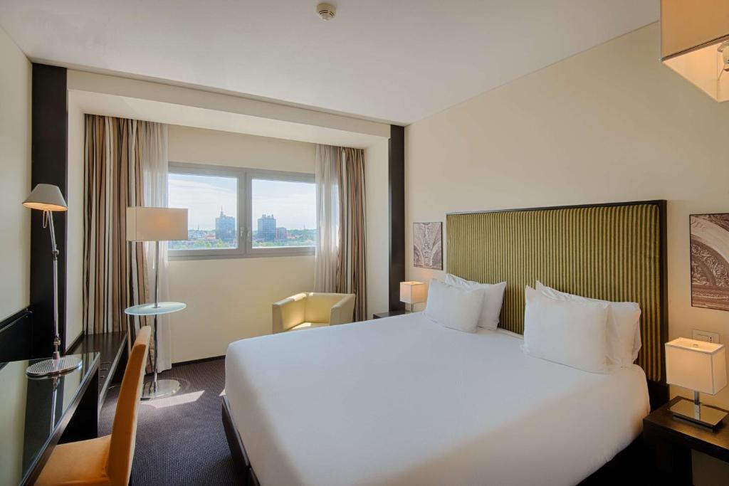 Postel nebo postele na pokoji v ubytování Savhotel Mantegna Padova