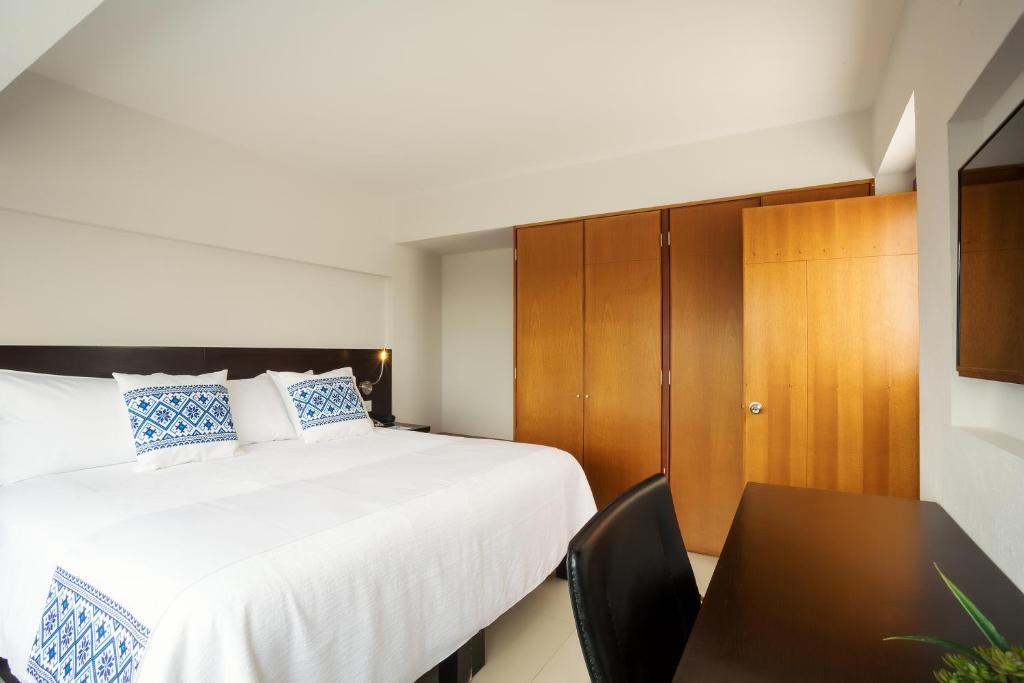 Postel nebo postele na pokoji v ubytování Hotel Indigo Guadalajara Expo by IHG