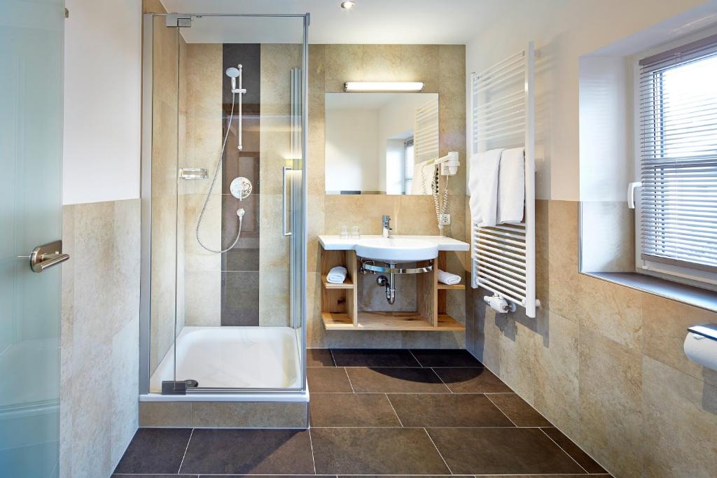 Kúpeľňa v ubytovaní Hotel Flatscher