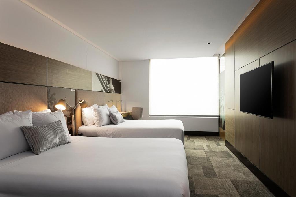 Postel nebo postele na pokoji v ubytování EK Hotel By Preferred Hotels Group