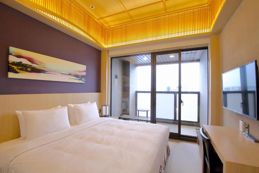 Postel nebo postele na pokoji v ubytování Kloud Hotel
