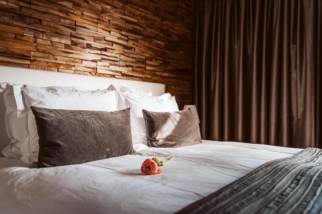 a stuffed animal is sitting on top of a bed at B&B Bleiswijk in Bleiswijk